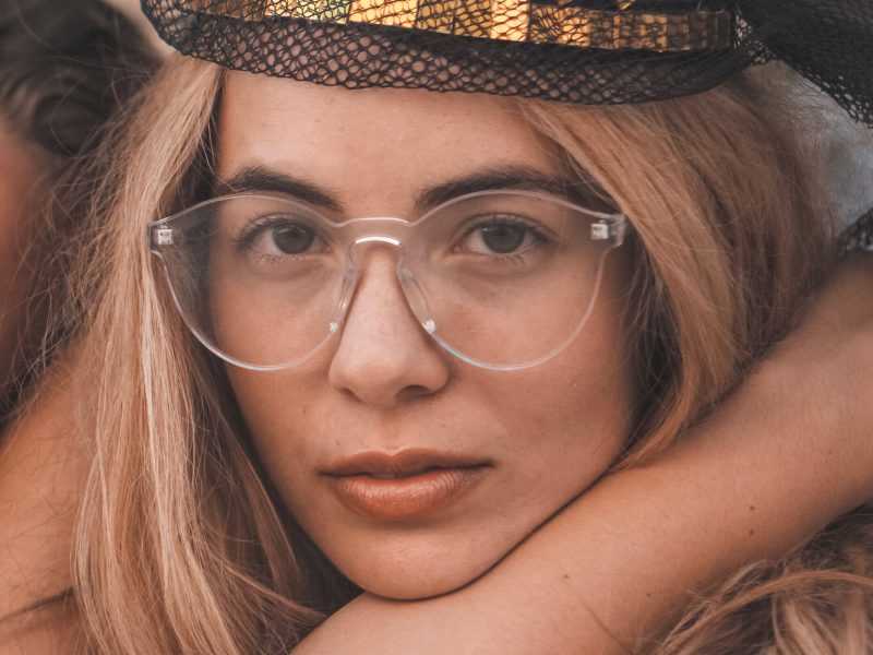 women in clear glasses and hat