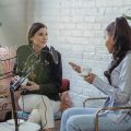 women working together in podcast room