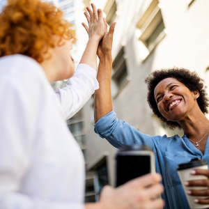 women high fiving