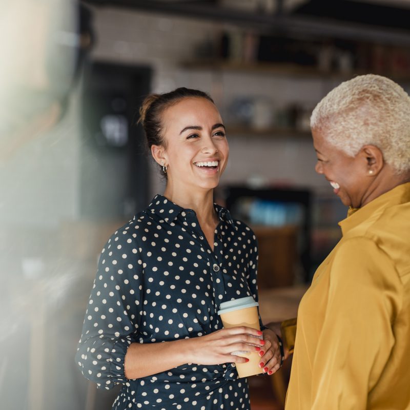 women having coffee, smiling